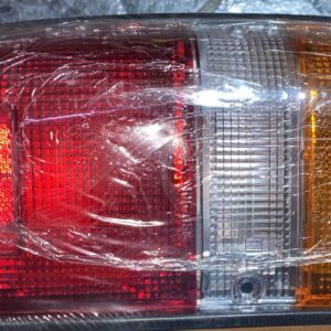 81560-39875 LH | FAROL TRAS HILUX 84-88 NIQ